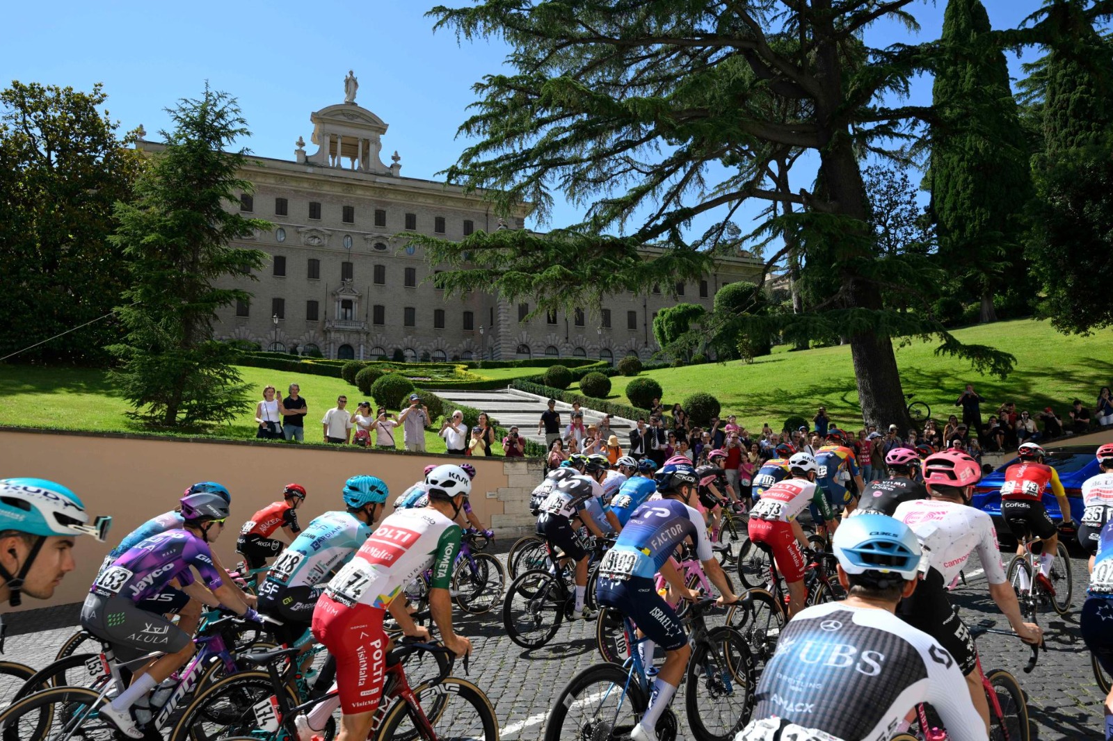 Pope Leo XIV greeted the riders as they passed through Vatican City ...